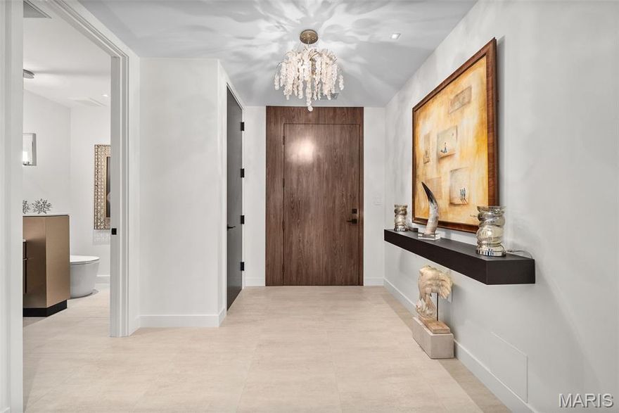 Stunning, sophisticated & sleek best describe this one-of-a-kind condominium in Clayton’s premier high-rise, the Plaza in Clayton. Completely gutted to the studs and a thoughtfully redesigned floor plan sparing NO expense.   2+ bdrms, 2.5 baths with modern & tasteful finishes everywhere you look. Elegant living & dining rooms w/ electric fireplace, 24” x24” porcelain tile flooring, motorized window treatments, opens to 2 customized balconies overlooking the fountain at the Ritz Carlton.  Epicurean’s dream kitchen w/ custom cabinets, Viking appliances, 140 bottle, wine chiller, generously-sized center island (9’6” x 4’6”) w/ seating for 4/5 opens to family room with additional fireplace, dry bar & ample storage & built-ins.  Cozy study off primary suite is an ideal home office, spa-like primary bathroom with soaking tub & roll-in shower, custom fitted & lit closets through-out.  2nd bdrm w/ on-suite, bath complete w/ roll-in shower & custom closets. Architectural lighting plan. Every inch of space has been utilized for maximize functionality & storage.  Enjoy life on a grand scale...only at the Plaza in Clayton.  24-hour doorman, pool, health club with treatment room, dog park, valet attendants, add’l storage, club room w/ full kitchen & a lending library.