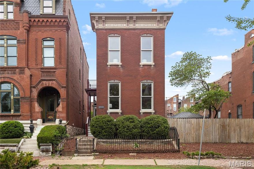 Step into this beautifully renovated home where thoughtful updates meet timeless character. A new TPO roof, EV charging station, and a spacious two-car garage set the tone for modern convenience, while newly refinished original wood floors and updated lighting and plumbing fixtures, plumbing stacks, and copper water lines along with updated  electric enhances the home throughout.

The heart of the home is the redesigned kitchen, featuring a new island and sleek Frigidaire stainless steel appliances—perfect for both everyday living and entertaining. Three fully new bathrooms showcase quality finishes, and the home offers two wood-burning fireplaces, including a charming stove, adding warmth and character.

A flexible first-floor bedroom—currently staged as a living space—offers versatility to suit your needs. Upstairs, the primary suite is a true retreat, complete with a private deck overlooking the yard, a spacious walk-in closet, and a beautifully appointed bath with a large shower. A second-floor laundry adds convenience, with an additional laundry setup in the basement.

The upper level also includes a generously sized front bedroom and a second full hall bath. The semi-finished lower level offers incredible potential, featuring a private-entry space with a full bath—ideal for a guest suite, office, or income-producing opportunity, as zoning allows.

Situated on a rare double lot in the upper quadrant of Soulard, this property offers space seldom found in the area—plenty of room to create your own outdoor oasis, even a pool. The original wrought iron fence stands as a nod to the home’s history, while its location in sought-after Soulard Heights places you just moments from the neighborhood’s vibrant energy, festivals, and charm.
2 car garage with an additional off street parking space for that treasured golf cart and space to add more parking should you need it.