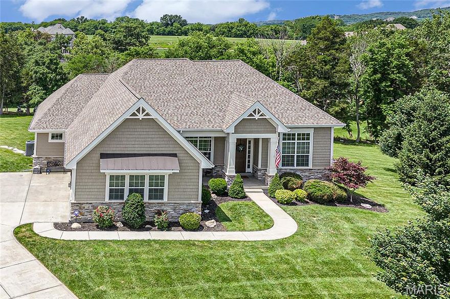 Stunning atrium ranch on premium 1.36-acre cul-de-sac lot on Pevely Farms golf course! With over 4,300 sqft of beautifully finished space, this light-filled home offers private views from every angle. The spacious and open floor plan welcomes with 12’ ceilings, 8’ doors, oversized windows with added transoms, gorgeous wood floors, formal dining and front office with glass doors. Chef’s kitchen features custom cabinetry, huge island, gas cooktop, double wall ovens, stainless steel appliances, stone backsplash, granite counters & designer vent hood, all open to spacious living room w/ stacked stone fireplace with wood beam mantel. Wall of windows along the open stairs to LL bring tons of light and impressive sunroom off kitchen leads to composite deck and amazing yard. Primary suite offers private entry with tray ceiling, spa-like bath w/ dual vanities, tiled dual-head shower plus large linen & walk-in closets. Mudroom w/ cubbies at garage entry, half bath, separate laundry room plus 2 secondary bedrooms with walk-in closets and full bath complete the main level. Outstanding lower level w 4th bedroom, full bath, large windows and full bar with multiple rec areas. Walk out to covered patio w/ under decking and fire pit extension to enjoy peaceful views of the expansive yard between the 12th & 13th holes. Rockwood Schools, close to I-44, future Route 66 State Park Bridge and neighborhood path leading to Castlewood Park trail system. Truly a must see!