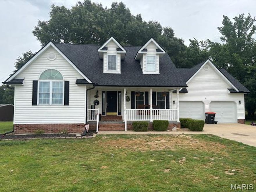 If you want a beautiful Cape Cod home away from the daily rush, this place could be just what you’re looking for. This 23-year-old, vinyl-sided, one-and-a-half-story Cape Cod sits on a quiet cul-de-sac and nearly an acre of partly wooded land. The cozy front porch welcomes you into a spotless home with a warm, neutral color palette. On the main floor, you’ll find hardwood floors, a laundry room, and a relaxing primary suite with a vaulted ceiling, crown molding, and a lunette window. The bathroom features a tiled walk-in shower with glass doors. The kitchen maintains a neutral look with white cabinets, black solid-surface countertops, and stainless-steel appliances. There’s a separate dining room for family meals. The living room is a great spot to unwind after work, with a vaulted ceiling open to the upstairs, a gas-log fireplace, alcove bookcases with cabinets below, and patio doors leading to a concrete patio with new railings and balusters. Upstairs, you’ll find a full bathroom and two more bedrooms overlooking the living room. If you need extra space or a home office, the basement is partly finished with a large family room, another full bathroom, and a den. Outside, you can enjoy your morning coffee on the front porch, the screened porch in back, or the patio. There’s also seating around the firepit, perfect for relaxing and listening to the sounds of nature. For storage or hobbies, there’s a 24-by-30-foot outbuilding with a concrete floor and electricity. For peace of mind, the roof and gutters were replaced just a few weeks ago, and a transferable warranty covers the roof. The upstairs furnace was replaced two years ago, and the main level furnace was replaced about six months ago.