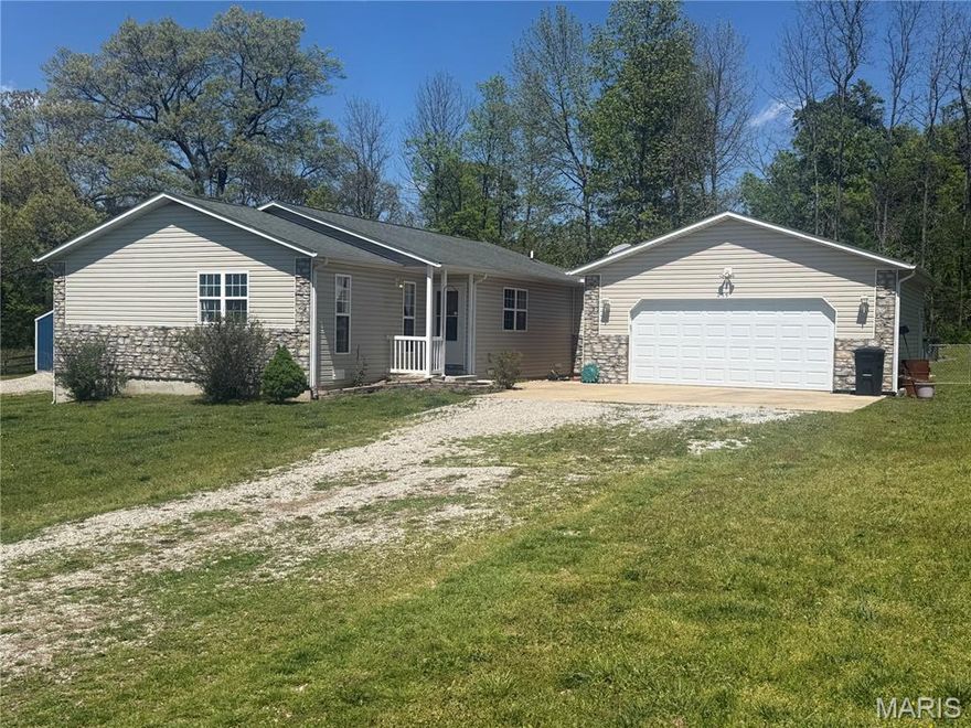 Super Cute Ranch Style Home, just outside the city limits on 1+ acres. 2 Bedroom 2 Bath. CH&A with a heatpump. Attached 2-car garage. Detached one-stall carport. Fenced backyard with above-ground saltwater pool. (to be let out 5-18). Living room with tray ceiling. The kitchen has a tile backsplash. breakfast bar. Lighing under the cabinet. Large pantry with shelving and French doors. Break bar. Dining room. Walks out to the patio. The master bedroom has French doors, a private bath, and a large walk-in closet.