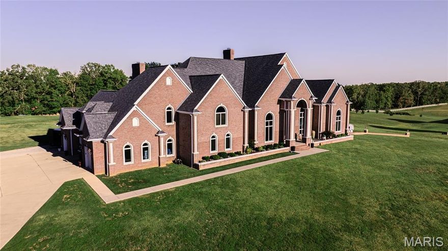 Dreams do come true! This extravagant home is available to be your Dream Home. Step through the arched doorways to a one-of-a-kind, custom-designed home located in Poplar Bluff, the heart of Southeast Missouri, and is an answer to all of your heart's desires. This magnificent, 5-bedroom, 6-bathroom (if you count the unfinished bathroom in the basement), Contemporary home had much planning put in the minor conveniences you never thought you needed or wanted. It was built with all the amenities including a custom kitchen, 3 living areas, breakfast area, formal dining room, coffee/wine area, 6 fireplaces, 3 laundry rooms, custom tray ceilings, 2 separate upstairs wings, 4-car, upper level, attached garage, and a 2-car, lower level, attached garage with all the storage you could possibly need. Upon entering, you'll immediately be in awe and take note of the unique, custom designed tray ceilings, 22 ft, massive, stone fireplace with surrounding bookshelves, and custom mantle. As you look straight through the floor-to-ceiling windows across the room, you'll have an amazing view of the pool. Take note of the recessed lighting and hardwood flooring surrounding you. Minor details in every room make it perfect. Kitchen includes an island with sink, cabinets, drawers, and a bar with dishwasher. With 3 pantries, ample countertops for your cooking needs, 5-burner, gas-burning range top, pot-filler, cabinet-covered refrigerator/freezer, and built-in oven and microwave to complete your kitchen desires. Inside entertainment at its finest with the luxury of roaming from the formal living room, dining room & kitchen to the informal family room all with the possibility of enjoying your guests and never feeling crowded. If relaxation is what you're searching, the primary en suite was designed as perfect place for seclusion & relaxation and is ideal escape to the hustle and bustle of daily life. Featuring 2 gas fireplaces, (1 is dual to custom bathroom), extra room for personal "living room area," 12' x 21' closet with laundry room #3, and loft for additional storage. Primary bathroom is an absolute dream come true! Custom cabinets designed for the comfort of 2 people, each having multiple storage cabinets and a sink. A private toilet room, 2-person, jetted bathtub, and walk-through shower designed for relaxation at its best with multiple jets, an overhead rain showerhead, and wand adds to the comfort for an enjoyable shower. More custom features include 18' x 19' laundry room with an island, tons of storage, 2 large, electric dryers for specialty items, entry by the 4-car garage (which currently houses a trampoline & basketball goal) and has custom designed cabinetry with bench, coat hooks, shoe drawers, and pet spa area down the hall. Most of these things are on the upper 2 stories with 11,330 sf. An unfinished basement, of 6,159 sf, is awaiting your personal touch to complete this home as you desire. The mechanical room has central vacuum system, intercom, security, 2 of the 4 Geo-Thermal Units, and surround system wired through multiple panel boxes. A total of 17,489 sf makes this home stand out in the neighborhood. Sunrises and sunsets are a must to enjoy inside or outside this beautiful home with all the windows which provide ample natural lighting throughout. Not only do you get all of the plush design inside, but you also have a fabulous entertaining area in your own back yard. Once you view this home, you'll never want to leave. An inviting, L-Shaped, salt-water pool completes the oasis with beautiful landscaping, a patio and two separate outdoor fireplaces; 1 wood-burning and 1 gas for entertaining or just relaxing in the comfort of your own home. The pool has a wading section up to 4-feet and a diving/slide area in 8-feet of water. A custom waterfall for relaxation was added for your enjoyment. All of this sits on 5 acres in an exclusive Gated Community just north of town in a desirable subdivision.