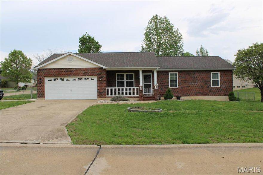 Nestled on just a bit over 1/4 acre among flowering trees on this corner lot you will find this lovely 3 bedroom ranch. Vaulted ceiling in living room. There is an oversized two car garage fully drywalled with side door access to yard. On the side of the yard is another driveway!  In the garage you will also find another door leading directly to the basement for times you don't want to carry items thru the house to the basement. Walk into your main floor laundry from the garage and into your full kitchen. Lots of cabinets and pantry. Breakfast room has sliding door to deck and another staircase to the lower level. The basement is an 8 ft poor with a bath rough-in just waiting for your finishing touches. Plenty of space here to designate specific areas you choose. The main floor has a nice size master bedroom with a generous master bath. There are two additional bedrooms and a hall bath. We are waiting for you to make this your home!