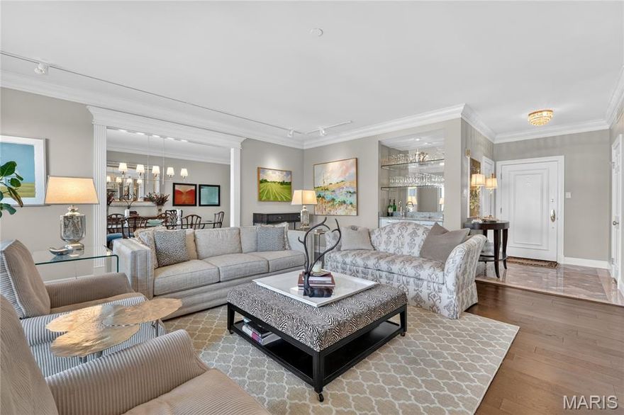 Stylish & Spacious Condo in a Prime Clayton Location! An imported marble entry sets the tone for this elegant, light-filled residence, where a refined great room with 9’ ceilings, crown moldings, rich hardwood floors, and a sophisticated wet bar frames sweeping views of downtown Clayton. Step onto your private terrace to enjoy morning coffee or evening sunsets with stunning views extending to the Arch. Designed for both everyday living and effortless entertaining, the expansive formal dining room flows seamlessly into a custom kitchen featuring European-style cabinetry, granite countertops, ceramic tile flooring, and custom lighting. The spacious primary suite is a true retreat, offering abundant custom built-in closets and dual private baths—one with a tub—creating a spa-like experience. A generously sized second bedroom with an updated bath provides ideal space for guests, family, or a home office. Thoughtful updates and features include newer windows, cedar closet, in-unit laundry with additional storage, newer carpet/hardwood flooring throughout the main living areas. This exceptionally maintained, full-service building offers outstanding amenities, including a 24-hour door attendant and parking attendant, secure garage parking (2 spaces included), pool and patio, private storage locker, dog park, catering kitchen, guest suite, and a dedicated property and resident manager. Ideally located just steps from Clayton’s premier restaurants, shops, and business district, with convenient access to downtown, major hospitals, and surrounding suburbs. Move-in ready and offering the perfect blend of comfort, convenience, and sophisticated living.