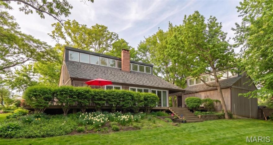 Architecturally Significant Retreat on a Private Wooded Acre. Price improvement allows you to make this unique property your own. 

Experience the perfect blend of architectural distinction and natural serenity in this stunning custom-designed residence inspired by Vermont vacation homes. Designed to embrace its surroundings, this 3 bedroom/4 bath home offers privacy, light and exceptional indoor-outdoor living. The home was built by Higginbotham Bros. a leading custom homebuilder in St. Louis.

Step into the dramatic living room featuring vaulted ceilings, a stunning fireplace with wood stove and expansive windows that frame breathtaking views of the surrounding woods. Clerestory windows add architectural character while inviting a soft, natural light throughout. Interlubke shelving and Wood-Mode cabinetry throughout. 

The thoughtfully designed open floor plan offers generous living spaces ideal for both everyday comfort and entertaining. A wrap-around deck provides the perfect setting for gatherings, seamlessly extending your living space into the outdoors where you can enjoy tranquil scenery and perennial plantings. The primary suite located on the main level serves as a private retreat, complete with a spa-inspired bath featuring a sauna room for ultimate relaxation. Just off the primary unwind in your private spa and outdoor shower, surrounded by nature. A comfortable den and large kitchen complete the first floor. 

The second level offers two generously sized bedrooms, two bathrooms, a library with vaulted ceilings, an office space and ample storage. 

Additional highlights include: 
Finished basement offering flexible living or recreation space with a second wood stove, full bath, built-in wood shelves, laundry room and ample storage. 
Spacious three car garage, invisible Pet Fence and Security System. 
Stunning wooded views from multiple vantage points. 

This architecturally significant home is a rare opportunity to own a private sanctuary that combines timeless design with modern luxury amenities. Ideal for those who appreciate nature, privacy and refined living.