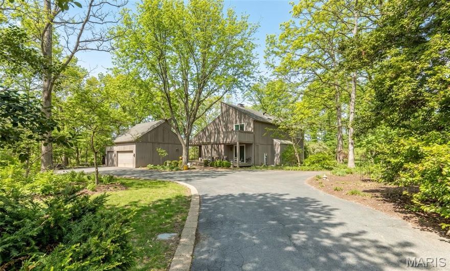 Architecturally Significant Retreat on a Private Wooded Acre. Price improvement allows you to make this unique property your own. 

Experience the perfect blend of architectural distinction and natural serenity in this stunning custom-designed residence inspired by Vermont vacation homes. Designed to embrace its surroundings, this 3 bedroom/4 bath home offers privacy, light and exceptional indoor-outdoor living. The home was built by Higginbotham Bros. a leading custom homebuilder in St. Louis.

Step into the dramatic living room featuring vaulted ceilings, a stunning fireplace with wood stove and expansive windows that frame breathtaking views of the surrounding woods. Clerestory windows add architectural character while inviting a soft, natural light throughout. Interlubke shelving and Wood-Mode cabinetry throughout. 

The thoughtfully designed open floor plan offers generous living spaces ideal for both everyday comfort and entertaining. A wrap-around deck provides the perfect setting for gatherings, seamlessly extending your living space into the outdoors where you can enjoy tranquil scenery and perennial plantings. The primary suite located on the main level serves as a private retreat, complete with a spa-inspired bath featuring a sauna room for ultimate relaxation. Just off the primary unwind in your private spa and outdoor shower, surrounded by nature. A comfortable den and large kitchen complete the first floor. 

The second level offers two generously sized bedrooms, two bathrooms, a library with vaulted ceilings, an office space and ample storage. 

Additional highlights include: 
Finished basement offering flexible living or recreation space with a second wood stove, full bath, built-in wood shelves, laundry room and ample storage. 
Spacious three car garage, invisible Pet Fence and Security System. 
Stunning wooded views from multiple vantage points. 

This architecturally significant home is a rare opportunity to own a private sanctuary that combines timeless design with modern luxury amenities. Ideal for those who appreciate nature, privacy and refined living.
