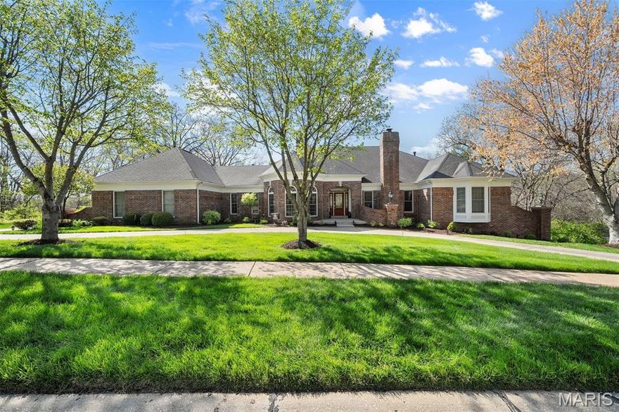 Rarely does a home strike a balance of architectural presence, privacy, & over 6,000 SF of purposeful design. Set on a wooded lot, this atrium ranch lives like a private resort. A PebbleTec pool, screened porch, and seamless indoor-outdoor flow offers everyday luxury living. The vaulted great room is flooded with natural light & the formal dining provides an elegant setting. The spacious office boasts built-in bookshelves & a fireplace, and the eat-in kitchen is adorned with stainless steel appliances, gas cooktop, custom cabinetry, & a large center island w/ quartz countertops. The main-floor primary suite is a private retreat w/ sweeping views, spa-like bath, & dual walk-ins. Two additional main-floor bedrooms, Brazilian Walnut floors, & rich architectural detail throughout. The walkout LL offers two more bedrooms, one w/ a sitting room, two full baths, wet bar, and media room. All in sought-after Wildhorse Village w/ trails, tennis, & community pools. Extensive upgrades throughout.