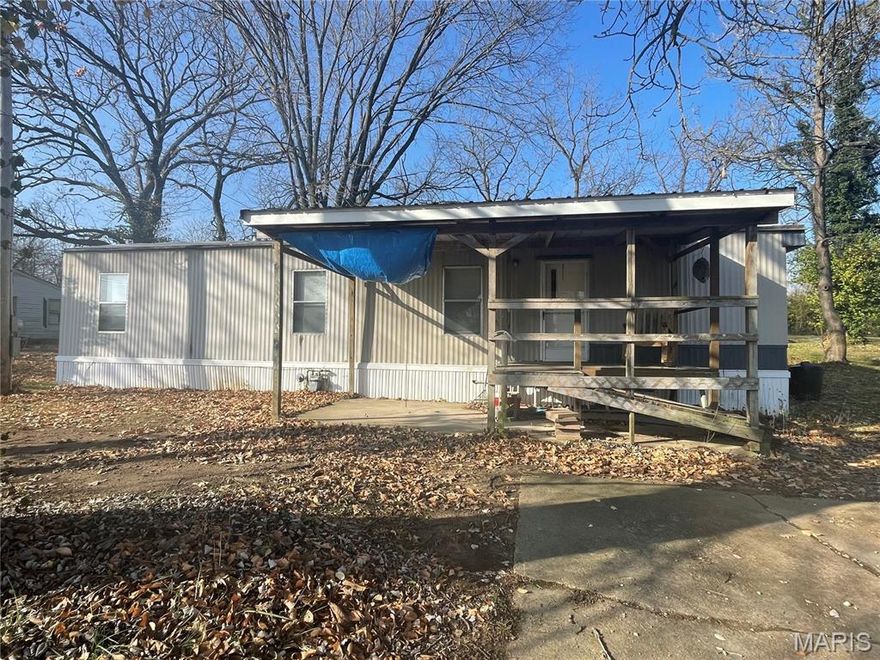 2 bed 1 bath mobile home sitting on .55 acre corner lot in town. Close to Wal-Mart. Needs a little TLC. It would make a great starter home or an Airbnb.
