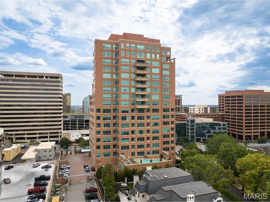 Discover the epitome of luxury living in Clayton's prestigious Maryland Walk high-rise condominium. Perfectly situated in the heart of downtown Clayton, this elegant 10th-floor residence places you just steps away from a vibrant array of dining, shopping, and grocery options. Spanning 2,414 square feet, this sophisticated 3-bedroom, 3-bathroom condo is bathed in natural light through expansive windows. The custom-designed Primary Suite is a serene retreat, complete with a luxurious bathroom featuring dual vanities, two separate water closets, a jetted tub, and a full-length custom closet. The gourmet kitchen is a culinary delight, equipped with top-of-the-line Viking appliances, including a four-burner gas cooktop, dishwasher, wall oven, and convection microwave. A Samsung double-door refrigerator/freezer and a new washer/dryer set in the nearby laundry/utility room further enhance convenience. For added privacy, the residence offers a second bedroom suite, a versatile third bedroom/office, and a full hall bath. The open-concept design seamlessly integrates the kitchen, dining, and living areas, extending to a generous balcony with stunning south, east (the Arch), and west-facing views of Clayton. Maryland Walk residents enjoy exclusive amenities, including guest suites, a fitness center, a communal pool, and a spacious top-floor entertainment area. With two-car parking, this residence perfectly blends style and comfort, offering a truly exceptional living experience.