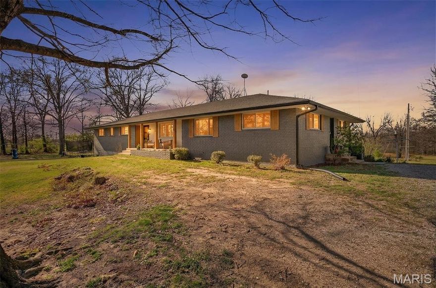 Welcome to 19849 Hazel Road... where there's ALL the space you've ever dreamed of and more! Featuring a massive all-brick ranch home with a full finished basement, a brand-new 30 x 50 foam-insulated shop, a 3/4 acre pond, pool, all on TWENTY ACRES just outside of town! The home's exterior just had a FULL renovation, including a new roof, painted brick exterior, cedar shutters & porch, and all new Pella Low-E windows throughout. The 30 x 50 outbuilding features 3 extra large garage doors, electric, concrete floors, and foam-insulated walls & ceiling. The home offers EIGHT bedrooms; four on the main level and three on the lower level, FIVE bathrooms (3 full & one half on the main level and 1 full bath on the lower level), along with two large living rooms on the main level and one more on the lower. Each bedroom is very spacious, with beautiful views out of every window. The main level has had many recent updates, including freshly painted walls, ceilings, trim & doors, 2 brand new bathrooms, and some updated flooring. The basement is set up as a private space with its own entrance, perfect for multi-generational living or an at-home business. Newer stainless appliances stay with the kitchen, there is a woodburning fireplace on each level, plus a 2 car garage in the basement. The lot is a nice mixture of woods and cleared space, offering you the rural setting of your dreams. Act now to call it YOURS by summer!