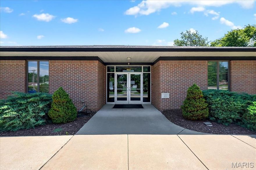A rare opportunity to own a landmark property in Florissant. Welcome to the Lutheran Church of the Living Christ at 2725 Concord Drive—a sprawling, well-maintained campus situated on 6.9 acres just off New Halls Ferry Rd. Originally built in the 1960s with a thoughtfully designed addition in 2010, this versatile and functional facility is ideal for a church, nonprofit, school, or community organization. The sanctuary features soaring ceilings, beautifully preserved woodwork, and vibrant stained glass, with pew seating for 150+ and potential to expand capacity with chairs. A dedicated A/V room offers flexibility for sound and media. The main level includes several private offices, a large conference room, a copy/production area, ADA-compliant restrooms, and multiple entrances. The lower level impresses with a full commercial kitchen featuring a Wolf range, commercial dishwasher, and refrigerator, plus wide-open, partitionable rooms perfect for classrooms, events, childcare, or outreach programs. Additional highlights include a fellowship hall, updated mechanical systems, and thoughtful storage throughout. Water fountains and built-in amenities on both floors add to the building’s ease of use. Surrounded by ample parking and green space, the property is as accessible as it is welcoming. Lovingly cared for and move-in ready, this is a turnkey opportunity. Most furnishings and equipment are negotiable with the sale.