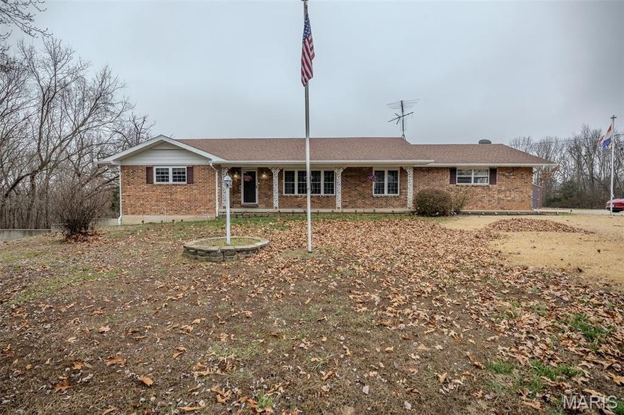 Just what you've been searching for! This place offers so much: a peaceful setting on 40.71 acres of prime hunting land, an all-brick ranch home with many updates, a walk-out basement, and 3 outbuildings. The kitchen just got a lovely facelift, including new white cabinets, marble-look countertops, backsplash tile, and black SS appliances.  The main floor has new interior doors and light fixtures throughout. The hardwood floors, tile, and carpet are all in excellent condition, and the home has been recently painted. The electric heat pump is 8 years old, roof is 9 years old, and the HUGE composite deck is nearly brand new (you can hunt right from your back deck if you wish!).  The screened gazebo has composite decking and electric, making it perfect for entertaining. If you want the country life with lots of seclusion while being ON PAVEMENT, this is the one to see! Book your showing today and you can be all settled in before summer arrives!