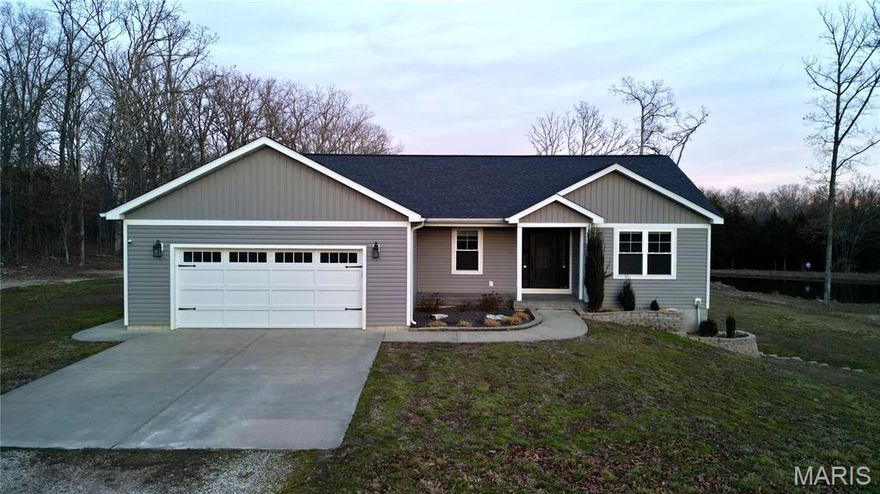 Welcome to this stunning well built custom home, thoughtfully crafted to blend modern comforts with peaceful country living. Set on 4 beautiful acres, this property offers privacy, open space, and a serene natural backdrop—all while delivering the convenience and reliability of newer construction. Step inside to a warm and inviting main-level layout featuring 3 spacious bedrooms and 2 full baths. The open-concept living, kitchen, and dining area is filled with natural light and designed for easy living and entertaining. The kitchen comes fully equipped with all appliances, making this home truly move-in ready from day one. The functional layout ensures everyone stays connected, whether you’re hosting gatherings or enjoying a quiet evening at home. The outdoor features are where this property truly shines. Enjoy peaceful mornings by your private pond with pavillion, or unwind in the screened-in patio, where you can sip coffee or enjoy a good book without interruption. Just steps away, the adjacent fire pit offers the perfect setup for cozy nights.  With open acreage surrounding you, the possibilities are endless: gardening, outdoor activities, exploring nature, or simply enjoying the quiet. The full finished basement adds exceptional space and flexibility. You’ll find a large second family room perfect for movie nights, gaming, or a home gym. The basement also includes a full bathroom and two non-conforming bedrooms, making it an excellent fit for guests, home offices, hobbies, or multi-generational living.
Whether you’re looking for a place to relax, entertain, or enjoy the outdoors, this home offers the best of all worlds—modern style, peaceful surroundings, and room to grow. With all appliances included, it’s truly a turnkey opportunity.
Homes like this are rare—schedule your private showing today and experience everything this exceptional property has to offer
