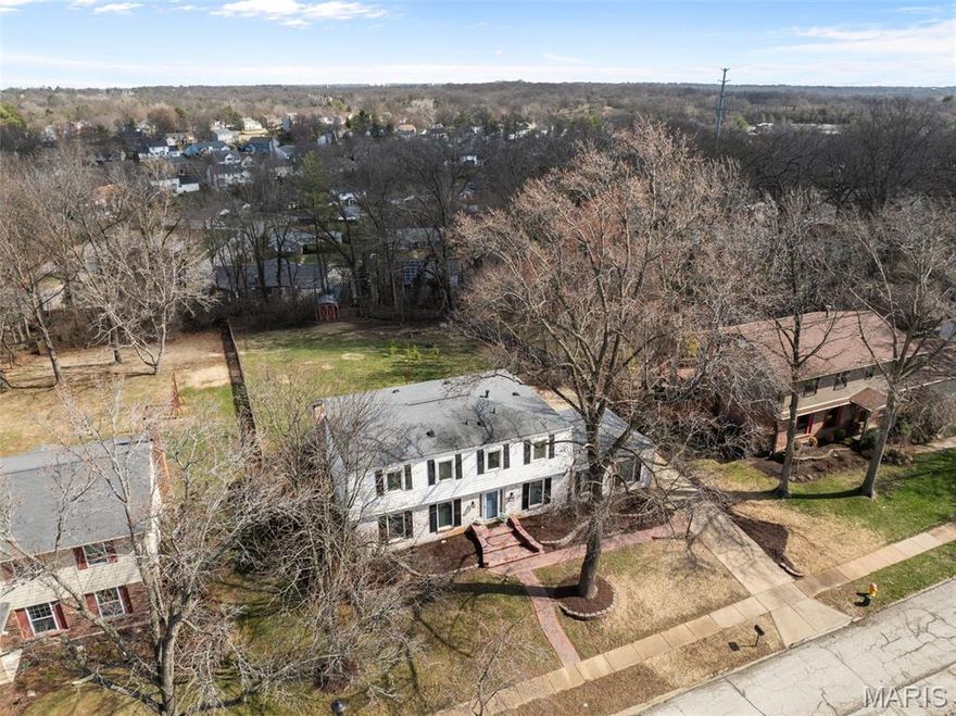 Improved Price! Open House Sunday, 3/22, 1-3pm! Nestled on over a  half acre lot in the desirable Fox Creek Estates, this beautifully updated two-story home offers space, style, and comfort with over 3,200 sq ft of total living area and a true 5-bedroom layout.
Step inside to find custom lighting, detailed millwork, luxury vinyl plank, and hardwood floors throughout. The main level features a formal dining room, spacious living room, and cozy family room with a stunning stone fireplace and built-in shelving.
The gourmet kitchen is the heart of the home with soft-close cabinetry, center island, quartz countertops, tile backsplash, stainless steel appliances, and double oven. The adjoining breakfast room is filled with natural light and offers heated tile floors, along with access to a coffee station with wine fridge.
Recent improvements include new Andersen windows, a refreshed primary bathroom with new vanity and heated floors, and a darling completely remodeled half bath. Upstairs you'll find the spacious owner’s suite with walk-in closet plus four additional bedrooms served by a large hall bath with jacuzzi tub. Enjoy outdoor living with a screened-in porch, deck, and expansive backyard. The finished lower-level rec room with LVP flooring and recessed lighting adds even more living space.
Residents enjoy the subdivision pool, nearby Queeny Park, and highly rated Parkway West schools. Welcome Home!