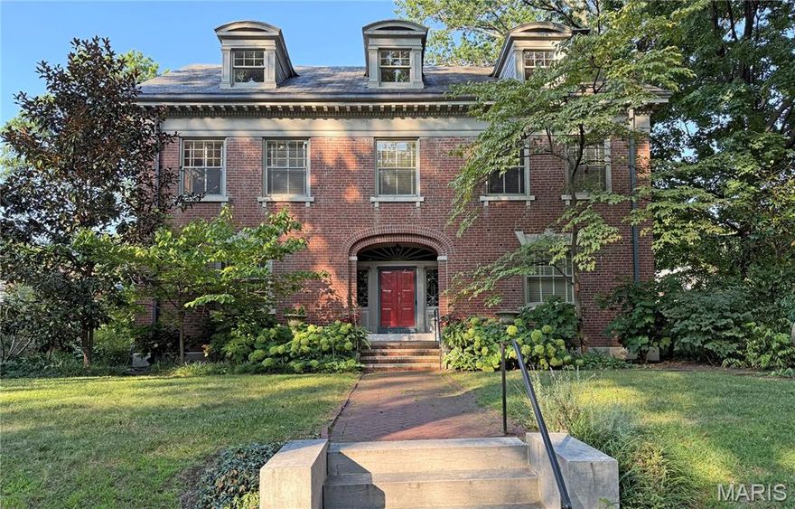 Don't miss this elegant home in Parkview. Large rooms with leaded glass windows, gleaming wood floors, original millwork -- all surrounded by a garden paradise. One of the few Parkview homes on a double lot with an oversized, two-story, two-car garage.  You'll enter into the large central hall, framed by a gorgeous dining room, with its bay window and built-in china cabinets. Turn right to enter the large living room, with its gas-log fireplace. Double doors open to a large screening porch.  Enjoy the cozy landing sitting room with its diamond shaped windows and mirror lined display cabinets.  On the second floor you'll find:  an ensuite primary with a wood-burning fireplace and 3 walk-in closets;  plus 3 other bedrooms (one with a laundry closet (new washer/dryer)) and a hall bath.  Hall bathrooms have original claw-foot tubs.  Third floor boasts four large bedrooms with dormer windows and an adorable hall bath.  Large dry basement.  Home sits across from one of Parkview's neighborhood parks.  Walking distance to Washington University, the Loop, Forest Park and the metro. Parkview is a lively neighborhood that hosts concerts and events.  On the National Register of Historic Places, see its website www.ParkviewNeighborhood.org for Indentures (single-family occupancy only) and renovation guidelines.