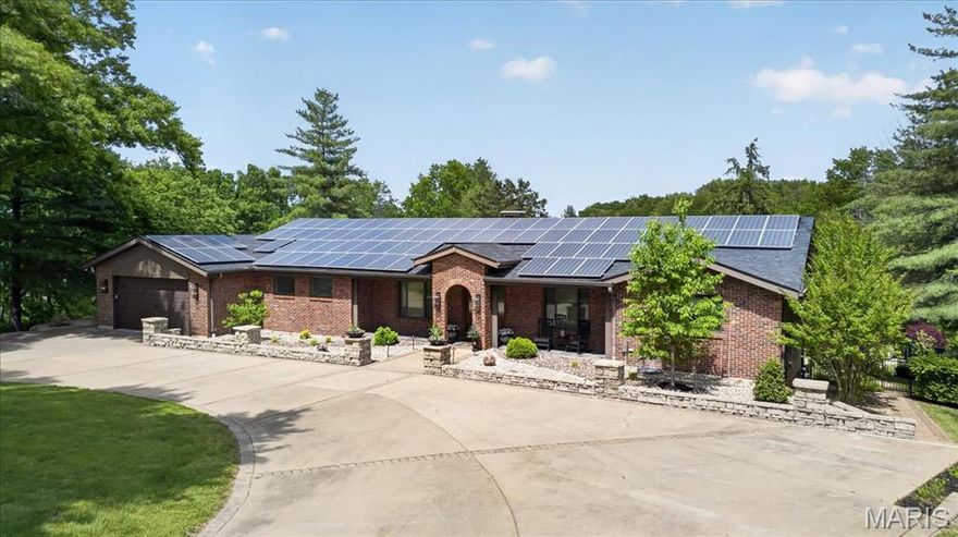 Welcome to this sprawling ranch set on a stunning, park-like 4.45-acre lot. Thoughtfully updated with style, this 3-bedroom, 3 full bath home offers the perfect blend of comfort, character and opportunity.  The beautifully renovated kitchen opens seamlessly to the family room, where vaulted ceilings, a striking wood beam and large picture windows bring the outdoors in. An open and inviting entryway, beautiful solid wood doors, a solid brick exterior and a circular drive add to the home’s timeless appeal.  Down the hall, you’ll find two bedrooms, a full bath and the private primary suite, complete with its own full bath, walk-in closet and deck overlooking the serene backyard. At the front of the home, a spacious office with French doors sits opposite the formal dining room, also featuring French doors, creating flexible and functional living spaces.  The kitchen and family room walk out to a spacious patio, ideal for outdoor dining and relaxing. The lower level is an entertainer’s dream, complete with an incredible vintage wood bar with stained glass, a lounge area, a large recreation room perfect for ping pong, skee-ball, and more, plus a full bath and an oversized room that could easily serve as a fourth bedroom. A walkout leads to the expansive patio and amazing pool, all surrounded by the beautiful park-like setting.  An added bonus: the property may offer parceling potential, creating a unique investment opportunity for those looking to maximize the land’s value. Buyer to verify with St. Louis County.  This is a home where you feel like you’re on vacation every day, yet you’re just minutes from everything.