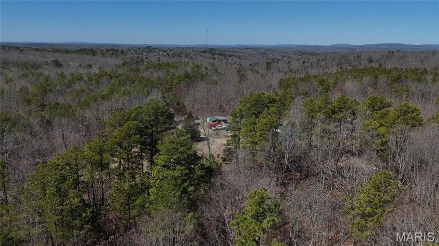 Nestled near the Wayne and Madison County Line, once selectively harvested (approx. 40) years ago, the land has naturally regenerated, creating a thriving, diverse woodland perfect for those who appreciate its near-original state. Say Hello to this near 82-acres of the ultimate destination for outdoor enthusiasts!
Come take a look at this 81.4 Acres with 880 sq. ft. Home - Off-
Grid Ready equipped with Modern Utilities! This home with electricity connected, is unique property find and is ideal for anyone seeking self-sufficiency or a peaceful escape. With two 1,500-gallon water tanks for rainwater collection and solar panels as backup power, it blends comfort with sustainability. Whether you are looking for a hunting paradise, a peaceful weekend retreat, or a recreational escape, this property delivers! The charming cabin offers 2 bedrooms and 1 bath, making it the perfect place to unwind after a day exploring the great outdoors. The land, secluded, yet accessible between Poplar Bluff and St Louis. Abundant wildlife, rolling terrain, and endless adventure await! Don't miss your chance to own this slice of Missouri wilderness!