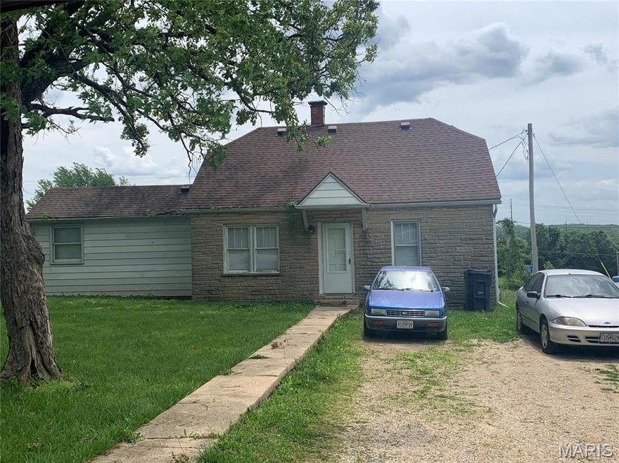 Great opportunity with I44 visibility. This 2+ acre tract includes a 1200 metal shop building, and single family home over 800 square feet. The metal shop building has a large off street parking area, and separate parking with the home. Both buildings are leased at the time of listing. The home is 3 bedroom 1 bath with off street parking.  This property has about 300 feet of County Road frontage plus over 300+ feet of I44 visibility. Sale includes the following two parcel ID's: 71-04-7.0-36-002-006-001.000 & 71-04-7.0-36-001-004-012.002 of 2.08 acres m/l. Location: Hwy/Interstate Frntg