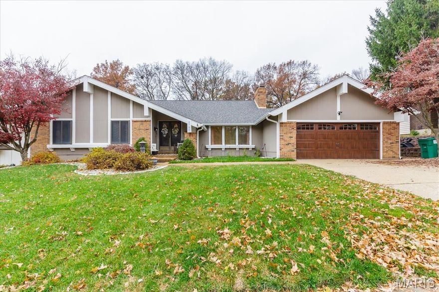 An exceptional 3-bedroom, 2-bath ranch set on a beautifully landscaped, expansive lot.  This impressive residence offers a seamless open-concept design with over 2,400 square feet of thoughtfully living space. A welcoming foyer leads into a dramatic vaulted Great Room, formal Dining Room, ideal for entertaining. The kitchen has been upgraded with quartz countertops, refreshed cabinet doors, a stylish backsplash, sliding pantry shelves, and updated lighting. It provides direct access to the patio and flows effortlessly into the inviting Family Room anchored by a classic brick fireplace. The main level is anchored by a luxurious primary suite featuring deck access, ample closet space and a beautifully renovated master bathroom.  Two additional well-proportioned bedrooms and a full bath complete the main floor.  Additional improvements include luxury vinyl plank flooring in the basement, fresh exterior paint, a new garage door and opener, professional landscaping, and a new patio with patio door (2024). Major system updates include a new HVAC system (June 2022), new roof and gutters (September 2022), upgraded electrical panel (2025), and a new dishwasher (2025).  The finished lower level offers a recreation room,  laundry area, and plenty of storage. Outdoor living is elevated with an expanded patio overlooking a level yard framed by mature trees and a serene wooded ravine with a private walking path. Ideally located near Hwy 94 and the Page Extension, this home offers a rare blend of elegance, comfort, and convenience.