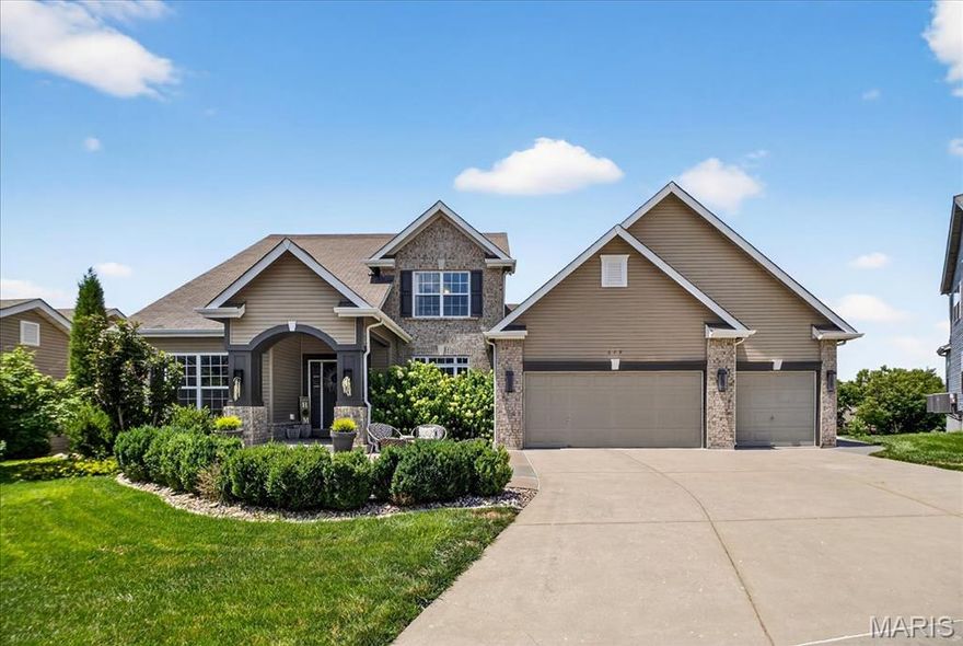 Welcome to 649 Wyndview Drive in Lake Saint Louis, MO 63367 — a breathtaking luxury residence tucked in a private cul-de-sac, offering the perfect blend of privacy, style, and resort-inspired amenities with panoramic views of the Outdoor Oasis. .This 5-bedroom, 4.5-bathroom showplace was designed to impress—featuring a Chef’s Kitchen complete with stainless steel appliances, quartz waterfall-edge island, cabinetry with glass accent panels and lighting. The open floor plan allows for a seamless flow from the Kitchen and Breakfast Room into the Great Room and Dining Room. Vaulted ceilings, window walls and fireplace complimented by rustic and modern finishes creates an inviting yet elegant atmosphere. The walk-out finished lower level adds year-round versatility with a Rec Room, wet bar, office space and a Wellness/Exercise Room. Retreat to the exterior living spaces complete with a pool with special seating, covered and open-air patios, expansive deck with multiple seating areas. The outdoor kitchen featuring a flattop griddle, refrigerators and storage are within close proximity to the custom limestone island making transitions to dining seamless. Car enthusiasts and hobbyists will appreciate the 3-car garage with a mini workshop, offering plenty of space for storage and projects. This property delivers the ultimate setting for entertaining or relaxing in true resort style and is the perfect combination of luxury and comfort! Check out this one of a kind gem!