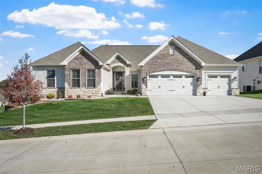 OPEN HOUSE on Sunday, 11/23/25 from 1-3pm!  BETTER THAN NEW CONSTRUCTION! 3 years young, with loads of builder UPGRADES, this STUNNING, NEWER home has everything completed for you that you would normally want to do after you had a home built. Professional landscaping & exterior lighting in front and back yards, in-ground sprinkler system, beautifully finished walk-out basement with "in-law" quarters, composite deck, covered patio, large extended patio, custom window treatments, UPDATED main floor laundry room with custom cabinet storage, quartz countertop, under mount sink & tile backsplash, & more! There is so much space to spread out in this beautiful home! Sitting on over a 1/3 acre lot with WATER VIEWS of Lake St. Louis, there is 4,500+ sq. ft of total living space with the finished lower level, 5 bedrooms, 4 bathrooms, & an OVERSIZED 3 car garage! Upon entering this home you'll see luxury vinyl plank flooring and neutral paint throughout, plenty of natural light with a wall of windows extended with transom windows, spacious great room with 12' ceiling & a floor to ceiling stacked stone gas fireplace. All of this opens to the gorgeous kitchen for easy entertaining. Cooking will be a breeze in the kitchen with loads of counter space, an oversized center island featuring Jenn Air stainless steel appliances, quartz countertops, a 5 burner gas cooktop & double oven. Continue your entertaining by stepping outside onto your large composite deck! Then later relax in your primary bedroom suite complete with a spa-like, oversized, tile shower and convenient his/her sinks/vanities. Plenty of space for your clothes, shoes & accessories in the OVERSIZED walk-in closets (one of which is the size of a bedroom!)! Get cozy in front of the 2nd fireplace in the thoughtfully designed finished lower level complete with a 4th bedroom, a 3rd full bathroom, family/rec area, kitchen/bar, and a 5th bedroom/private office space! This MUST SEE home is IMMACULATE and located in a top-rated school district & conveniently located near hwys 40, 70, & 364, shopping, dining, & more!