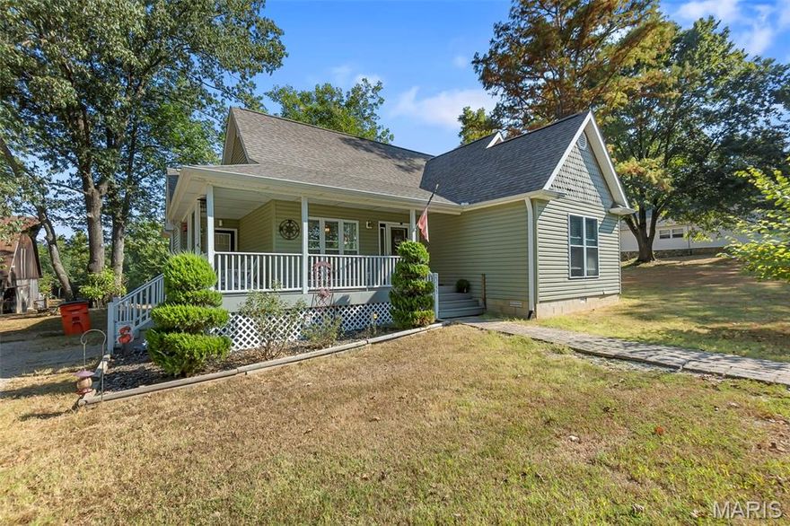 Built in 2017, this adorable home instantly feels warm and welcoming. The wraparound porch is perfect for morning coffee or evening conversations, and the screened-in back porch gives you a peaceful spot to unwind while enjoying the quiet surroundings. Step inside to an open-concept layout where the kitchen, dining, and living areas flow together seamlessly—just right for everyday living or gathering with friends and family. With two comfortable bedrooms and two full baths, the home offers both coziness and convenience. Outside, the barn with RV hookup adds plenty of flexibility, whether for storage, hobbies, or hosting visitors. Set in a private, serene location, this home is not only charming but truly livable—ready to be the perfect backdrop for your next chapter.