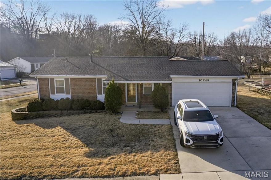This charming three-bedroom, one-bath home with a two-car garage is perfectly situated just minutes from Highway 270 and all the amenities St. Louis has to offer. Beautiful engineered floors greet you as you enter, and a bright, inviting living space flows into a thoughtfully updated bathroom. Recent improvements include a new driveway, new roof, new HVAC system, and an updated garage door. Main floor family room with ample natural light and convenient access to the kitchen for easy entertaining. The lower level offers ample space with a kitchenette, family room, and an additional sleeping area, plus ample storage throughout. Outside, enjoy a patio for entertaining and a yard designed for year-round enjoyment. Located close to shopping, dining, and entertainment with easy highway access, this well-maintained home won’t last long—schedule your showing today to experience the value for yourself.