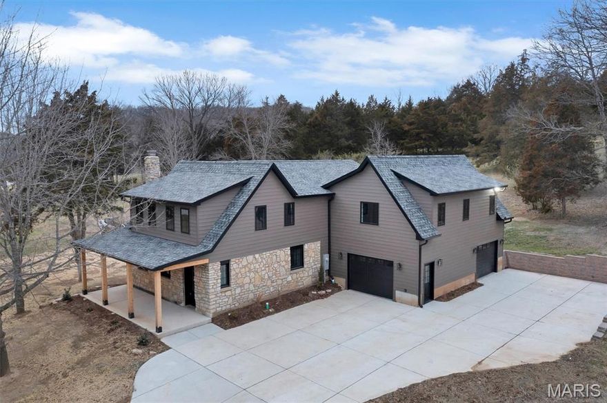 BACK ON MARKET - NO FAULT TO SELLER.  Set on nearly 3.9 private acres within the highly desirable Large Lot Residential (LLRD) zoning district of Eureka, this beautifully rebuilt Custom Craftsman-style residence offers a rare combination of brand-new construction, land flexibility, and long-term value. Originally built in 1939, the home was fully rebuilt following a fire, utilizing the existing foundation and locally sourced stone while delivering entirely new systems, finishes, fixtures, and appliances—truly everything is brand new. Offering approximately 3,496 square feet, the home features 4 bedrooms, 3 full bathrooms, and 1 half bathroom across two well-designed levels. The main level showcases engineered wood flooring, abundant natural light through Andersen casement windows, and a comfortable open layout ideal for everyday living and entertaining. The gourmet kitchen is a standout, featuring Thermador appliances, quartz countertops, custom cabinetry and a spacious island. The living room features a wood-burning masonry fireplace, with an existing gas line already in place for easy conversion if desired. The primary suite serves as a private retreat with high ceilings, generous proportions, and a spa-inspired bath finished with quartz countertops and modern fixtures. An additional flex room provides the perfect space for a home office, study, or hobby room. Outdoor features include exterior flood lighting, a gas line on the patio for a BBQ grill, and expansive acreage offering privacy, wooded views, and endless possibilities. Located in the Rockwood School District, this property blends luxury living with space, privacy, and convenience. WHY THIS HOME?? TRUE LARGE-LOT LIVING: Located in the LLRD zoning district, this property sits on nearly four acres—providing privacy, space, and long-term flexibility that smaller subdivisions simply can’t offer. FUTURE FLEXIBILITY: LLRD zoning allows single-family residential use with customary accessory buildings, offering potential for additional structures such as riding stables, detached garages, workshops, or other residential accessory uses (buyer to verify specific plans). BRAND-NEW WITHOUT THE WAIT: Enjoy the benefits of new construction—modern systems, energy-efficient features, and high-end finishes—without the delays or uncertainty of building from scratch. HIGH-END FINISHES THROUGHOUT: From Thermador appliances and quartz countertops to engineered wood flooring and Andersen windows, every detail was selected for quality and longevity. RARE ACREAGE IN A PRIME LOCATION: Properties of this size in Eureka are hard to find, making this a once in a life-time opportunity for buyers seeking land, privacy, and proximity to amenities. MOVE-IN READY WITH LONG-TERM VALUE: With zoning that protects lot size and surrounding land use, this home offers not just luxury today—but confidence in the future character of the area. Homes like this don’t come along often—brand new construction, acreage, and zoning flexibility in a prime location. Come see it and imagine the possibilities.