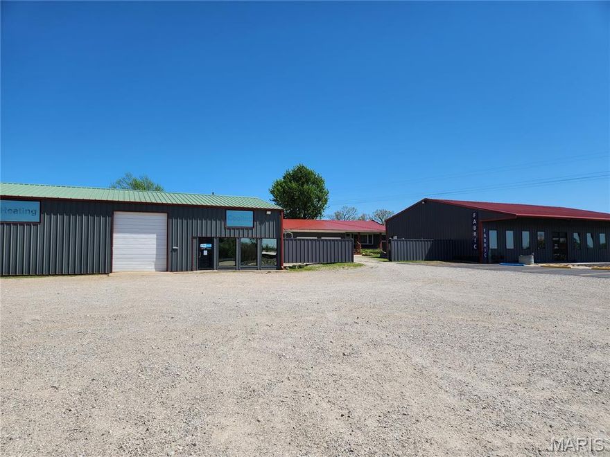 5 flat acres with I-44 Frontage and close exits both East and West!  Great visibility with 4 billboards & RV hookups on the extra land.  NOT IN CITY LIMITS.  This property has 4 buildings (currently used for manufacturing, retail, residential, & storage), 3 phase power, efficient HVAC, AND OWNER FINANCING OFFERED FOR QUALIFIED BUYER. The manufacturing-type building is currently an HVAC shop with 3840 sq. ft and loading docks, built in 2004.   The Retail building was built in 2017, is 2400 sq. foot and can be connected to the manufacturing building.  The home is a beautiful 2800 sq. ft residence tucked behind the commercial buildings and boasting 4 bedrooms, an office, a huge dining area, 2 living areas, a walk-in pantry, and more.  The 5 acres is mostly cleared and flat and ready to be utilized.  Additional land & home available if needed.  Two of the buildings currently bring in 6K rental income/mo but can be vacant within 60 days of sale if buyer needs those buildings.  PRICED WELL BELOW APPRAISAL!