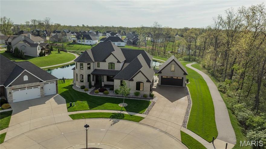 Live the resort lifestyle in this luxurious custom estate! Perfect for entertaining/relaxing, this upgraded 2-story home offers 4 BRs, 3.5 baths, a finished walkout LL & 5-car gar. The chef’s kitchen boasts marble/granite countertops, pro-grade appliances, DBL ovens, gas cooktop w/ pot filler & oversized island. Main floor features a theater rm w/ kitchen bar, game room & spa-like primary suite w/ Jacuzzi tub. Expansive windows & motorized shades frame backyard views. The three spacious BRs include WI closets. LL offers large entertainment area, add'l BR, cedar sauna, $10K steam shower dr & ample storage. Step outside to a paradise: saltwater pool w/ grotto waterfall, spa w/ infinity spillover, fire features, sun shelves & lush landscaping by a tranquil pond. Bonus highlights: a gym & finished gar w/ epoxy floors. Whether relaxing poolside, enjoying sunsets, or hosting unforgettable gatherings, this home delivers everyday luxury. It’s a lifestyle. See features & updates for details!