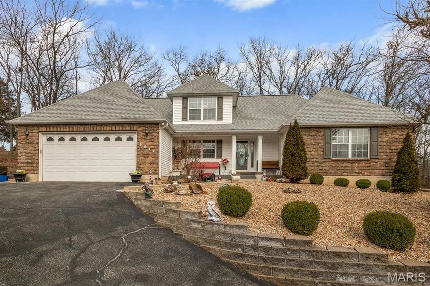 Beautiful home in highly desirable Raintree Plantation Golf and Lake Community. This 1 ½ story home features 5 bedrooms, 4 full bathrooms and amazing In-Law Quarters in the lower-level basement. You are welcomed with a large front covered porch that leads you into the entry foyer with an immediate eye-catching wood staircase. Just to your left is a separate formal dining room. Then straight ahead in the spacious living room with an amazing floor to ceiling stone gas fireplace, beautiful wood flooring, a vaulted ceiling and tons of natural light from the surrounding windows. The kitchen is complete with a breakfast room, beautiful cabinetry, granite countertops and access to the main floor laundry room. Master bedroom suite boasts a nice large bay window, hardwood flooring and huge walk-in closet. The accessible master bath is complete with a double vanity offering tons of storage and a walk-in shower. An additional nice-sized bedroom and full bathroom complete the main level of this home. Upstairs you will find great open views from the balcony down to the foyer and living room, 2 more generously sized bedrooms with large closets and another convenient full bathroom. Now onto the lower level that is remarkably done as an apartment/in-law suite. A complete eat-in kitchen with tons of cabinets and counter space along with an additional convenient laundry/storage area. The bedroom is spacious with a walk-in closet and a full accessible bathroom. Completing this lower level is a big family room with walk-out access. Onto the exterior you will notice a nice large back patio surrounded by trees and beautiful landscaping details around the entire home. Some other great additions include the oversized 2-car attached garage with an additional lower-level side entrance garage that would make a great workshop space. This home sits on the 13th hole of Raintree, which is just one of the many amenities of living in this private community, which also includes 4 lakes with boating and fishing access, a beach area, sand volleyball court, outdoor pool, country club, restaurant and of course the gorgeous golf course. So much to love about this home from the accessible details throughout, community amenities and so much living space! Do not hesitate making your appointment to come see this beautiful home!