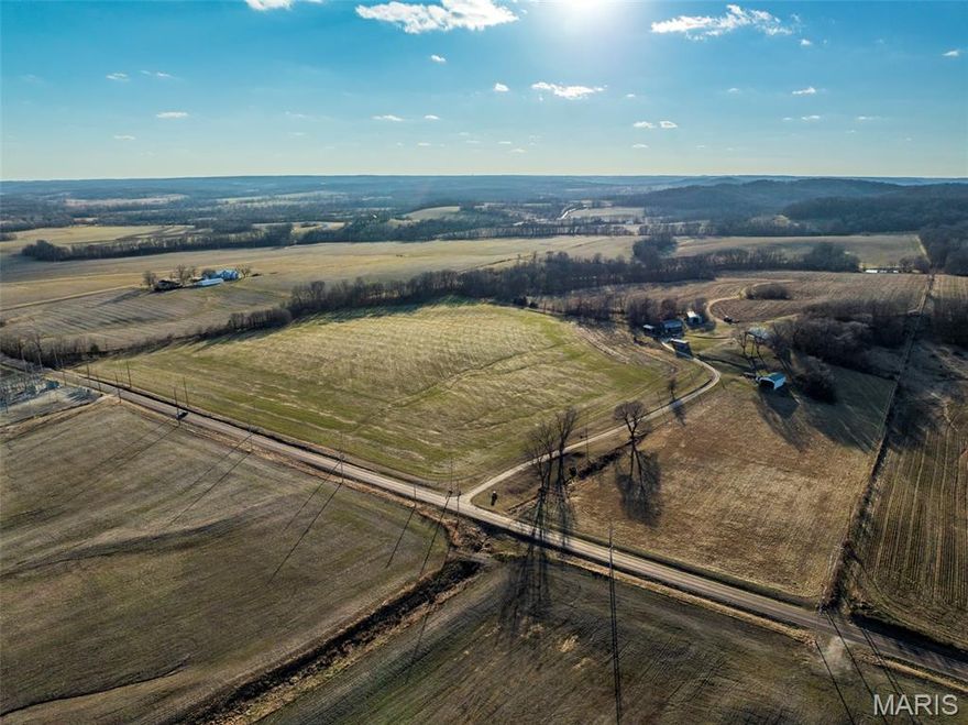 Premier 175.19+/- Acre Mississippi River Hills Farm – Pike County, Missouri
Offered for the first time in over 50 years, this exceptional 175.19+/- surveyed acre property is a rare opportunity to own a legacy farm in the heart of Missouri’s renowned Mississippi River corridor. Located just off asphalt State Hwy D, south of Louisiana, MO and east of Eolia, this tract combines productive farmland, mature timber, and breathtaking scenery. Of the total acreage, approximately 97 acres are tillable, featuring rich, fertile silt loam soils ideal for strong crop production. The balance of 78 acres in woods and grass provides outstanding recreational value and natural beauty, with rolling river hills, scenic views, and prime wildlife habitat. This farm lies in a highly sought-after area known for producing giant whitetail deer and wild turkey. The mix of timber, open ground, and natural contours creates exceptional hunting setups, travel corridors, and bedding areas. Mature timber also offers potential harvest value. Improvements include a well-built earth contact home, offering energy efficiency and low-profile country living, along with two equipment-type buildings suitable for machinery storage, workshop space, or farm operations. Whether you’re looking for a productive farm investment, a premier hunting property, or a scenic rural retreat with income potential, this Pike County gem offers it all.