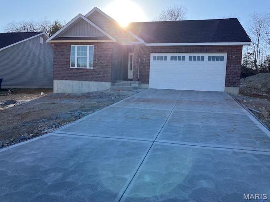 This ranch home to be built offers 2 bedrooms and 2 baths. Both bathrooms feature elegant ceramic tile flooring, with the main bath further enhanced with a ceramic tile shower. The centerpiece of the home is its stunning open great room, adorned with vaulted ceilings and vinyl plank flooring, complemented by three decorative windows that flood the space with natural light. The kitchen is a chef's delight, showcasing extensive cabinetry including a barn door pantry, a center island, and stainless-steel appliances. Sliding doors lead to a covered deck crafted from composite material, ensuring easy maintenance and providing an inviting outdoor space for relaxation and entertainment. Convenience is key with a main floor laundry room, ensuring efficiency in daily routines. The home also features a two-car garage, offering ample storage and parking. This home invites you to a lifestyle where comfort meets style in every detail.