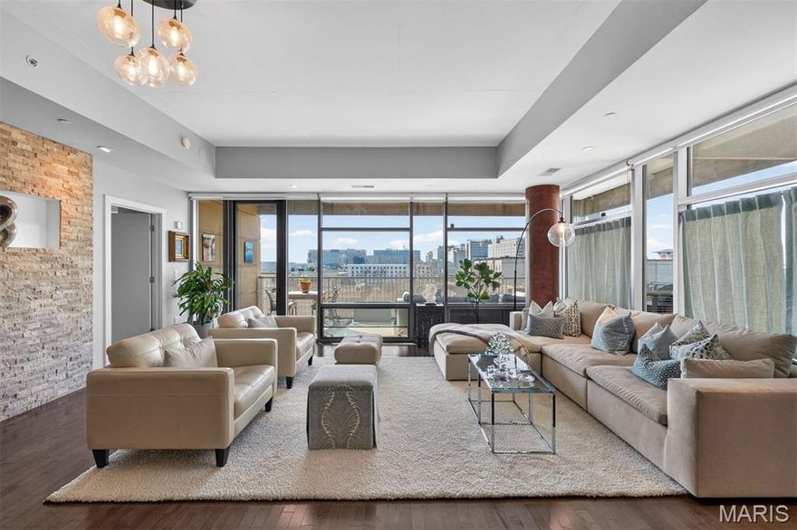 A private perch above the Central West End - where sunsets become a nightly ritual. Set in a striking concrete building with direct elevator access and doorman service, 4545 Lindell #20 offers full-service living where you can arrive home to ease, calm, and quiet luxury. A wall of windows pulls in golden light and skyline views, and the generous wraparound balcony sets the scene for slow mornings, late dinners, and city-light evenings - elevated above it all, yet right in the heart of it. The upgraded kitchen pairs beauty with function, featuring GE Café appliances, quartz countertops with a full-height quartz backsplash, and a custom tiled island made for meals and moments.The spacious, open layout includes three bedrooms and 2.5 baths. The serene primary suite features a walk-in closet, dual sinks, and an oversized jetted tub, for long moments of quiet luxury. Two assigned garage spaces, private storage, and amenities including a fitness room, an entertainment room with a prep kitchen and patio, and a guest suite complete this rare Central West End lifestyle—refined, effortless, and beautifully lived.