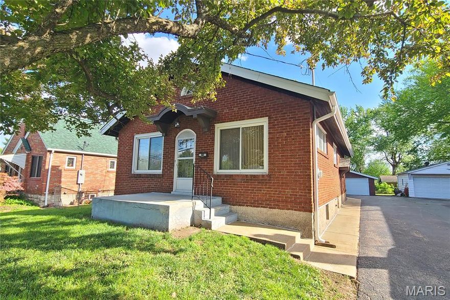 This attractive brick bungalow blends timeless curb appeal with comfortable interior spaces and the bonus of a large garage.  Enter to an open living space featuring warm wood floors and beautiful architectural details, including stained glass windows.  Find a fireplace in the living room and ceiling fans in both generously sized living and dining rooms.  The kitchen offers plenty of cabinet space for everyday storage.  You will delight in the two nicely sized main floor bedrooms with sizable closets, as natural light pours from large windows.  Downstairs, the home offers storage and workshop rooms, as well as a clean, versatile space ready to be transformed into additional living or recreation areas.  Major updates bring peace of mind with a new high efficiency HVAC system, updated panel, and newer PVC stack.  Plus, electricians just updated the wiring throughout the home!  Enjoy the outdoors with a fenced back yard, driveway and wide garage with opener.  The gem has already passed occupancy and is ready for your enjoyment.  Conveniently located with easy access to dining, shopping and schools, it provides a community feeling in one inviting package!