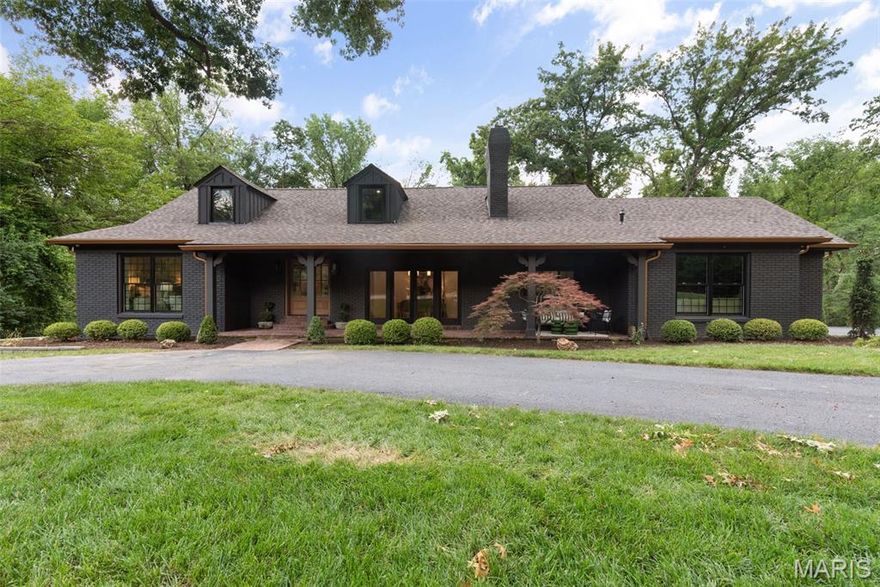 Secluded luxury meets everyday comfort in this stunning retreat set on nearly one acre of private, wooded land. This beautifully updated home offers a rare combination of elegance and functionality, starting with a main-floor primary suite complete with marble bathroom and spacious walk-in closet. The heart of the home is the sophisticated kitchen - thoughtfully renovated with modern finishes - opening seamlessly to airy living spaces adorned with white oak floors that flow throughout the first and second levels. Upstairs, you’ll find two generously sized bedrooms, each with its own ensuite bathroom - ideal for guests or family members seeking privacy. The finished lower level expands the living space with two additional bedrooms, a full bath, and a second kitchen - perfect for entertaining or multigenerational living. Walk right out to a large, in-ground pool surrounded by lush landscaping, and enjoy the convenience of a separate pool bath so wet feet never need to enter the house. A beautifully appointed pool house completes this outdoor oasis, creating the perfect space for summer gatherings. Don't miss your chance to own this one-of-a-kind property that blends refined design with resort-style living.