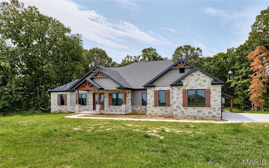 Brand new custom-built home on 3+ wooded acres in Kohler Estates subdivision. Features 4 bedrooms and 5 1/2 baths, a oversized 4 car garage with stair access to basement, a Great Room with a stone gas fireplace, with custom bookshelves, Gourmet kitchen offers  custom cabinetry with quartz countertops, tile backsplash, and a complete appliance package, and walk-in pantry with custom shelving. Master suite includes a tray ceiling, a large walk-in closet with custom shelving, and luxury bath with jacuzzi tub, dual vanities, and a tiled walk-in shower. 10 and 12 foot main floor ceilings with 8’ tall interior/ exterior doors. Laundry w/ sink & cabinetry, office with built in desk and cabinets, Hearth room with electric fireplace, a large covered patio, A large finished walk out basement with 9’ ceilings, a custom wet bar, a bedroom with a full bath, a large rec room and a separate workout/entertainment room with full bath. Conveniently located minutes away from Lake St Louis and Chesterfield!