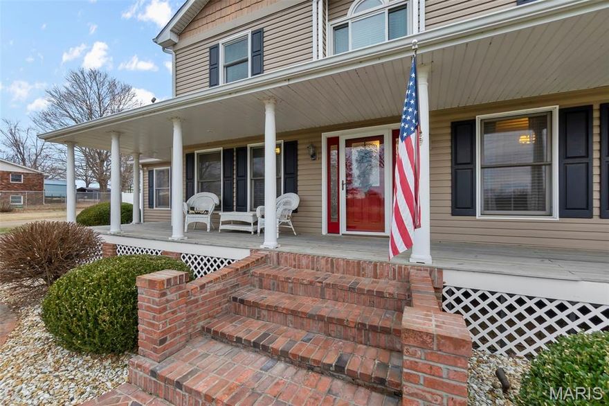 Minutes from Farmington city limits, with no HOA’s this updated two-story residence offers tons of living spaces on a large, level corner lot—where classic character meets modern refinement. From the moment you arrive, the home’s manicured landscaping and welcoming covered front porch set a tone of elegance. Inside, rich wood flooring throughout the main level, a layout designed for both entertaining and everyday comfort. The living room features a wood-burning fireplace insert and French doors that open to the back deck, inviting natural light and seamless indoor-outdoor living. At the heart of the home, the updated kitchen impresses with a vaulted ceiling, skylights, center island, and stainless steel appliances, creating a space that is as functional as it is striking. A formal dining room, additional sitting/living area, and a versatile fourth bedroom—ideal as a home office or guest space. The main level is completed by a laundry/mudroom off the two-car garage and a full bath with marble countertops and a timeless claw-foot tub. Upstairs, the primary suite offers double closets and a luxuriously remodeled en-suite bath featuring a freestanding soaking tub, tiled walk-in shower, and marble double vanity. Two additional large bedrooms with double closets and a half bath complete the upper level. The finished walkout basement extends the living experience with a spacious family or recreation area, full bathroom, utility room with exterior access, and a 50-amp generator hookup, offering both versatility and peace of mind. Thoughtfully updated and rich in character, this home delivers elevated living in a location that blends convenience with privacy. A rare opportunity to own a residence that truly feels like home—inside and out.  This home has a 1 year seller home warranty provided by America's Preferred Home Warranty.