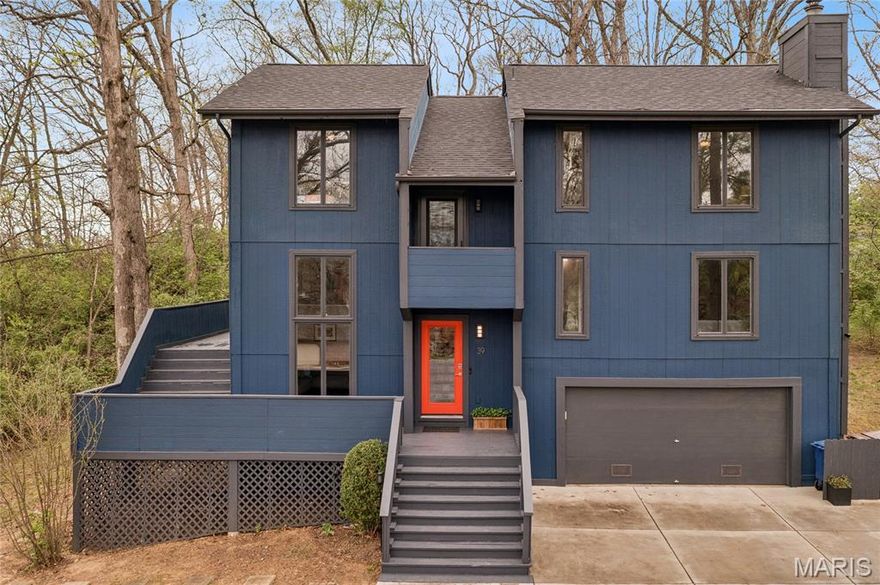 Lake life, but make it elevated. Welcome to 39 Metz Court, where design-forward living meets that effortless “we should probably host this weekend” energy. Tucked on a quiet wooded cul-de-sac just one block from the water, this multi-level stunner delivers 3 bedrooms, 3 full and 1 half baths, and the kind of indoor-outdoor flow that makes every day feel like a getaway.

Let’s talk lifestyle. Mornings start slow on the screened-in porch with coffee in hand, protected from the elements but fully immersed in the trees and fresh air. Evenings shift to the expansive wraparound deck where the grill is going, friends are lingering, and those peekaboo lake views remind you exactly why you chose this life. This is not just outdoor space… this is where memories get made.

Inside, you are greeted with a living/formal room with stunning, tall windows.  The main living level brings the heat with refinished hardwood floors, a dedicated dining space that opens seamlessly to the porch, and a kitchen that actually lives up to expectations. Think center island cooktop, premium KitchenAid appliances, abundant cabinetry, a built-in planning desk for real life, and just enough design detail overhead to make guests look twice. The living room is anchored by a floor-to-ceiling stone fireplace and flows effortlessly for both cozy nights in and full-on entertaining mode.

Upstairs, the primary suite is tucked away for privacy with a walk-in closet and ensuite that feels like your own retreat. Two additional bedrooms, a full bath, and upper-level laundry keep life easy and functional. The walk-out lower level adds even more flexibility with a full bath, bonus sleeping or office space, gym and room to adapt to whatever your life needs next.

And behind the scenes, the heavy lifting is already done. New roof in 2024, exterior and deck professionally painted in 2023, new driveway, structural deck and sunroom enhancements with concrete footings, upgraded electrical panel, refreshed sunroom, newer carpet upstairs, updated lower-level tile… all dialed in so you can simply move in and start living.

If you’ve been waiting for that perfect blend of lake proximity, outdoor living, and a home that actually feels different from everything else on the market… this is it. Just don’t wait too long, because homes that feel like a lifestyle upgrade don’t sit still.