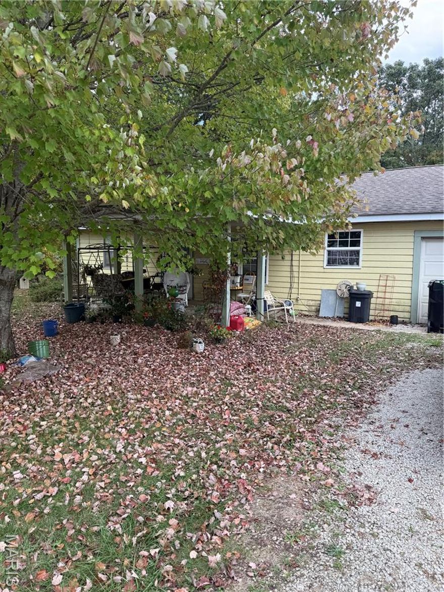 This 3 bedroom, 2 bath home sits on 1.5 acres offering the best of both worlds--a spacious, county setting right in town. This home needs significant updates and repairs, but with a little work, it could be a fantastic home or investment. If you're looking for a project with great bones and big potential, this one's for you.