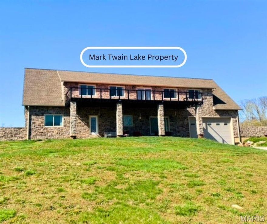 Mark Twain Lake custom built home on 3.3 acres offers an open concept floor plan with 10' ceilings, floating staircase, hardwood flooring, quartz countertop, large island with breakfast bar, beverage bar, upstairs is all open concept, possible extra bedrooms. Metal balcony 45x12, hugh attached garage.  1.5 miles to nearest boat ramp.  Come, experience the lake life. Proof of funds to purchase required or a pre-qualification letter from a bank to be provided before a showing.