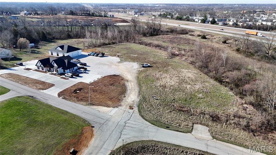 Great opportunity to own 2.84+/- acres (Lot 4) of commercial land in Moscow Mills. Located within a Business Park / Industrial Park setting, this property offers excellent potential for a variety of commercial or light industrial uses. The lot provides plenty of space for building, parking, equipment storage, and future expansion. Its strategic location allows for convenient access to surrounding communities and major roadways, making it an ideal location for businesses seeking visibility and accessibility. With continued growth and development in the Moscow Mills area, this property presents a strong investment opportunity for business owners, developers, or investors looking to secure commercial land in a growing market.