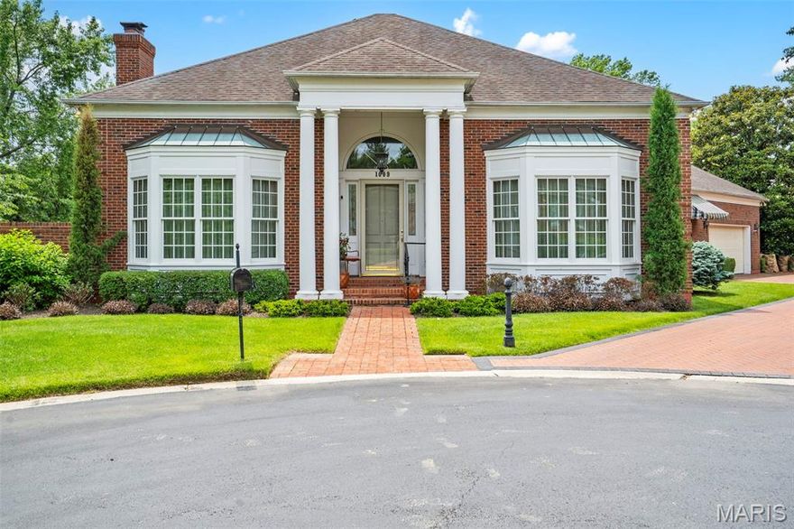 Don't miss this elegant Neoclassical home adjacent to Ladue. A grand two-story foyer sets the stage for this sophisticated residence, which offers a split front hall leading to expansive living and dining rooms. The richly appointed wood-paneled den features a gas fireplace and French doors opening to a large deck that runs the length of the living room, creating a seamless indoor-outdoor flow. Gleaming wood flooring throughout adds warmth and elegance. The bright, skylit kitchen is a chef’s delight with an eat-in area, spacious pantry, private patio access, and premium appliances including Miele dishwasher and refrigerator, Sub-Zero freezer, Scotsman ice maker, Dacor double ovens, and Bertazzoni 6-burner gas cooktop. Laundry is conveniently located off the kitchen. The main-floor primary suite is a serene retreat that includes a large walk-in closet and spacious bath. Upstairs are 2 addtl bedrooms, 1 full bath, and desk area. The finished lower level offers a family room with gas fireplace, large game room, bedroom and bath, and abundant storage. Lower level walk out to covered fenced patio. Large two-car garage. Nestled at the end of a cul-de-sac in a sought-after neighborhood with Ladue Schools!