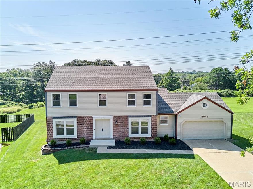 HERE IS YOUR CHANCE FOR A WONDERFUL HOME! Freshly painted main level. Kitchen and laundry room refrigerators, a newer washer and dryer, and a large TV are included in the sale! The seller has spent 40 wonderful years creating memories in this very well-maintained, traditional 2-story home. Now it’s your turn! Ideally located in the heart of Chesterfield, close to everything you need and within a top-rated school district. Recent updates include a new roof, gutters, and window wraps (August 2025), updated windows, a front double door and sliding door, a maintenance-free composite deck and stairs, granite kitchen counters and sink, luxury vinyl plank flooring, and the conversion of the main floor half bath into a full bathroom. Enjoy the convenience of a main-floor laundry room with a sink, folding counter, drying bar, extra refrigerator space, and lots of bonus cabinetry. The living room features double doors—perfect as a home office or playroom—and a cozy gas-start wood-burning fireplace with a brick surround and large mantle. Upstairs, you’ll find the primary suite includes a large walk-in closet and an en-suite bath with a vanity counter and linen closet. An additional 3 spacious bedrooms upstairs and 3.5 bathrooms overall. The finished walk-out basement offers a wet bar, half bath, and ample storage and walks out to a patio with flat yard backing to ample open common ground.