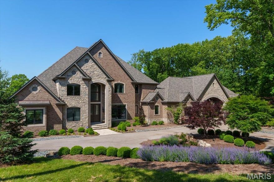 This stately home in the prestigious community of Huntleigh redefines luxury, combining elite craftsmanship, smart-home technology, and resort-style amenities including gated privacy. Equipped with 4 control stations and app driven, allowing you to effortlessly manage lighting, audio-visual systems, climate control, garage doors, and security. The gourmet kitchen boasts top-of-the-line Sub-Zero and Wolf appliances, including an exquisite Officine Gullo range. The lower level features a custom bar, Subzero beverage center, dual refrigerators, an ice maker, and dishwasher drawers. Stay in peak form in your own private fitness area, complete with custom flooring for heavy equipment and high-intensity training. Car enthusiasts will appreciate the motor court with 6-car heated garages and EV 220 electric outlets. Wine connoisseurs will be captivated by the custom 1200-bottle wine cellar. This estate also includes three laundry rooms and a Vault/Safe Room with 12” concrete and a fireproof door for added security. Outdoor living is equally impressive with a Gunite pool and spa, complete with a swim-up bar, two fire bowls, and a waterfall. The 22' outdoor pavilion features a full kitchen with a Subzero fridge, Wolf grill with rotisserie, stainless steel storage, sink, and ice maker. Custom A/V system includes a pool sound system with 14 hi-fi speakers and three in ground subwoofers. This estate is a masterpiece of design, offering the ultimate in luxury living.