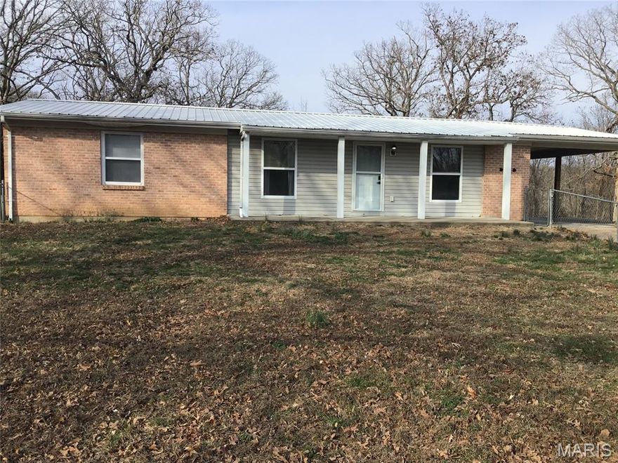 Great 3-bed 2-bath home on 5+acres. Easy access to I-44. The home features large rooms and lots of extra living area in the walk out basement if needed. The yard is very large and level, perfect for gardening and lots of room for an outbuilding or garage. There is also a large fenced in area in front for children or your fur babies. This property has lots of potential for addition, garage etc... and no HOA.