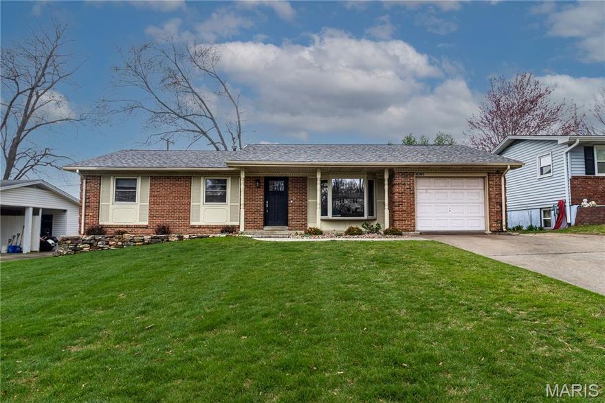 Welcome home to this adorable all-brick ranch!  The 3 bedroom, 1.5 bath home features hard wood flooring throughout the main level.  The large living room offers plenty of room to relax and gather and features a massive bay window to let in natural light including a bench to sit and enjoy the outdoors from the inside.  The expansive kitchen provides ample space for cooking and dining.  The kitchen also includes a pantry and extra space that could be used as an eat in area or converted to a mud room off the garage.  The bedrooms are comfortably sized and include closet organizers in each.  Step outside to enjoy the fully fenced in back yard and concrete patio to make entertaining easy!  The large unfinished lower level is perfect for extra room for all your extra needs.  With its classic brick exterior, welcoming layout, cozy feel and great price, this charming ranch is the perfect place to call home.