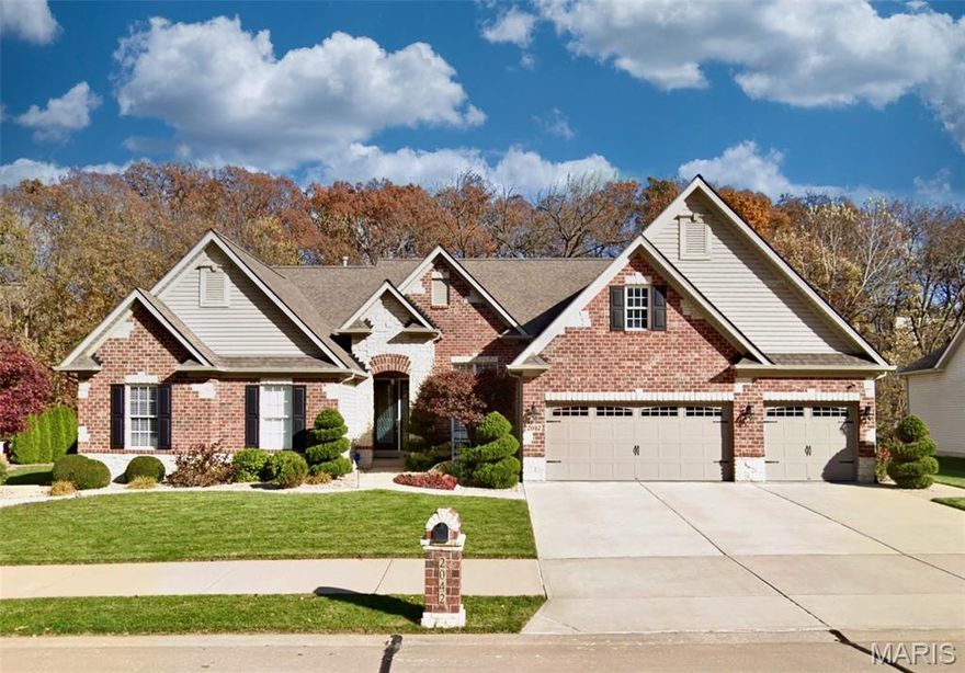 Multiple offers received.  Please submit your highest and best by ASAP. Welcome to 2042 Paul Renaud Blvd! A meticulously maintained, custom-built Modern Executive Ranch home. Featuring a timeless brick-and-stone exterior design that is built to last, and delivers BIG on eye-catching curb appeal! Located in Wyndgate Forest, a sought-after neighborhood consisting of larger, high-quality custom built homes. This home is perfectly situated for continuous year round scenic views, and is connected along the rear property line to more than 16 acres of wooded common ground and a winding creek!  Professionally landscaped property with in-ground sprinkler system (front and back yard) for a perfectly lush green lawn. While you're letting the sprinkler system take care of the grass, relax in the shade on the custom screen porch addition and watch the deer walking along the creek. Hang out with family and friends on the custom outdoor patio featuring a granite, stainless steel and stone outdoor kitchen, ready for parties and BBQ's. The home provides 4,359 sq ft of finished living space, 12 foot high ceilings in the main living areas, 4 bedrooms, 3 and 1/2 bathrooms, plus a main floor bonus room currently used as an office, easily used as a 5th bedroom if desired. Other features include a large chefs kitchen with stainless appliances, double ovens, 42" custom cabinetry and granite countertops. The Kitchen is wide open to the Breakfast room and Hearth room, spacious and bright with optional transom windows throughout, all are equipped with remote control sun shades. The wood burning fireplace has been upgraded with premium gas logs. Building mechanicals are updated for peace-of-mind with a new roof, updated dual zone HVAC systems and dual 50 gallon water heaters. The spacious primary suite provides 2 walk-in closets and gorgeously renovated en suite bathroom - with awesome walk in shower! The professionally finished lower level provides even more living space with a full bath, large open family room/game room flex-space, high ceilings and a great fitness room! Tons of room for all your stuff, with two massive connected storage areas in the unfinished portion of the basement, and even more storage in the expanded / oversized three car garage! See listing attachments uploaded for more info including; a prior survey, list of upgrades, floor-plan drawing, sellers disclosure, and more.