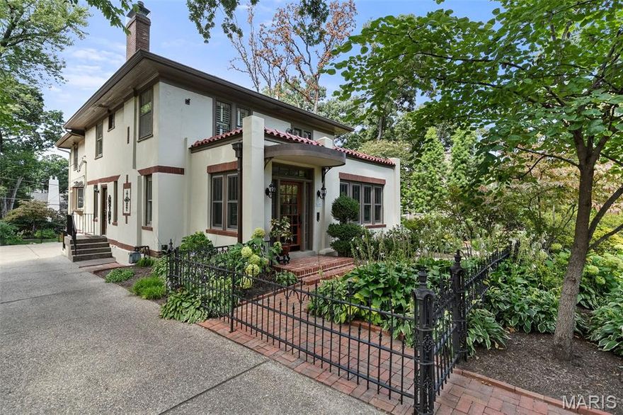 Step into a storybook setting with this 4 bedroom, 3.5 bath home, where timeless character echoes throughout 3,500 sq. ft. of living space. Tucked behind lush gardens and shaded walkways, this residence feels like a private retreat. Inside, generous living spaces invite gatherings, while the chef’s kitchen, complete with Viking appliances, makes every meal an occasion. Sunlit rooms, enchanting views, and thoughtful details add to the magic of this home. Upstairs are three well proportioned bedrooms with a shared full bath, along with a spacious primary suite and adjoining sitting area. The lower level offers a finished recreation area, a full bath, and laundry. Outdoors, winding paths, blooming landscapes, and quiet corners create a garden oasis perfect for morning coffee or twilight cocktails. Detached two car garage. Additional carport with EV charger.