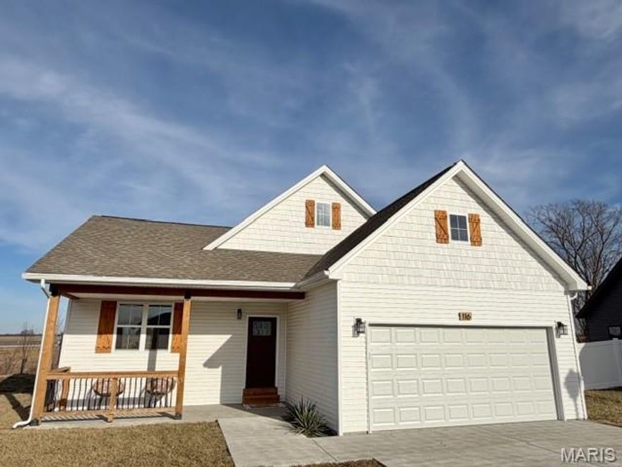 PRICE CHANGE... $284,000.  This like new construction features 3 Bedrooms, 2 Bathrooms, Main Floor Laundry, and a 2 car Garage. The lay out boasts an open floor plan with extraordinary lighting. Cathedral ceilings in Living room and Primary Suite, 9' ceilings throughout the rest of home makes home feel open and airy. Kitchen opens to spacious living room/dining room. Kitchen presents stainless steel appliances, Shaker style extended length cabinets for extra storage, floor to ceiling cabinet left of fridge, and lazy susan in corner. Primary suite features windows placed perfectly for additional lighting, but room to place furniture, walk in closet, private bath with dual sinks. Front foyer shares garage entry and coat closet, arched entry way to Living Room and Hallway. Tucked away laundry in the hallway, leaves extra room for a folding table. 20 x 17 back patio for entertaining and covered front porch. Easy access to Hwy 70 for commuting. New tree line across back of home.